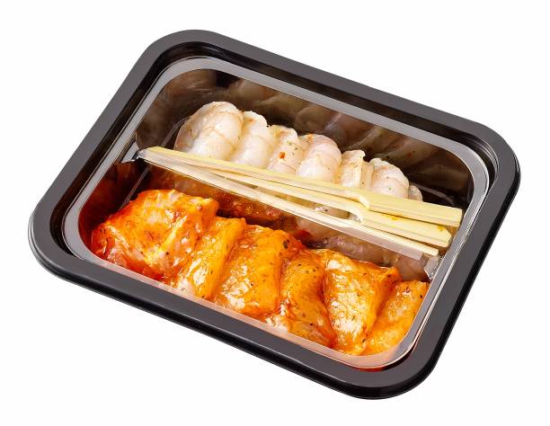 istock Package of raw chicken and shrimp isolated on white background 1402622611