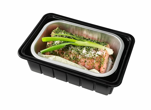 pork roulade in black plastic tray isolated on white with clipping path
