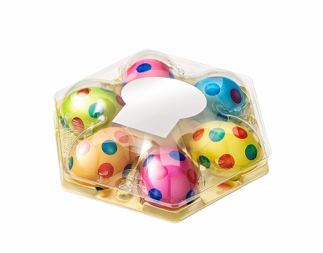 colored eggs on a plastic tray isolated on white.