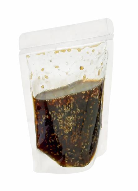 sesame soy wok sauce in plastic bag isolated on white