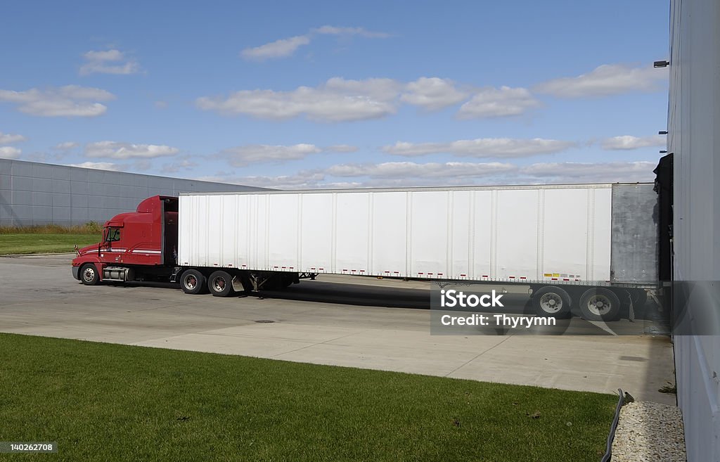 Parked Truck A truck which is being loaded or unloaded Semi-Truck Stock Photo