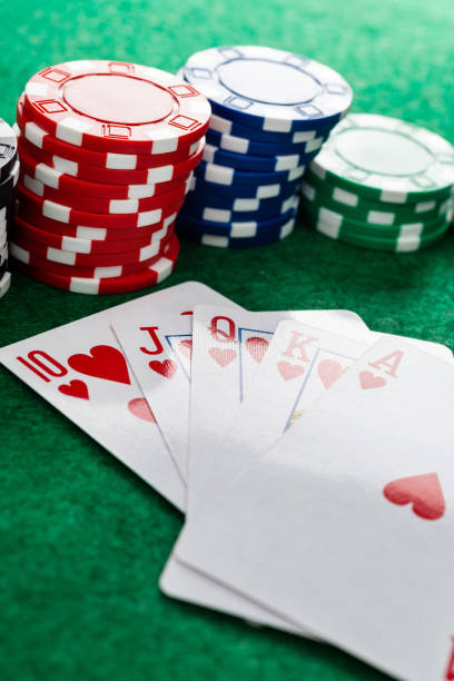 istock Royal flush and gambling chips on gambling table 1402627222