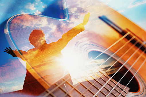 Spanish guitar abstract background and man with open arms. Relax music for travel road.
