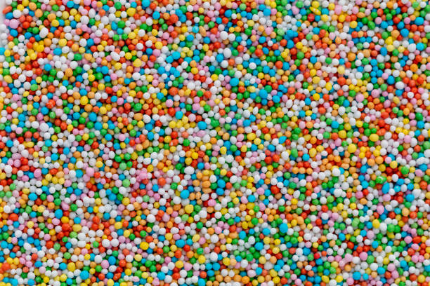 istock Thousands sprinkles tiny sugar beads for decorating cakes and desserts background. 1402629654