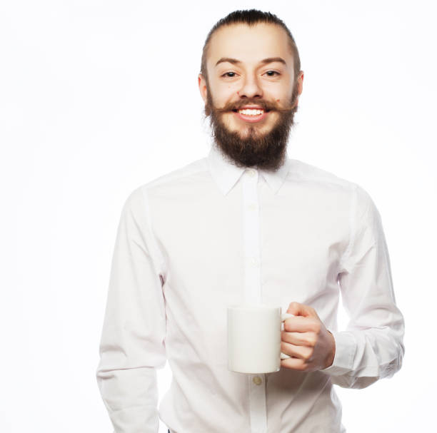 young man drinking a cup of coffee or tea isolated white background