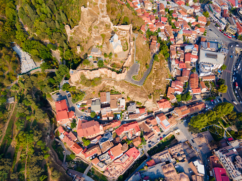 Abanotubani ancient district and Narikala fortress aerial panoramic view in Tbilisi old town. Tbilisi is the capital and the largest city of Georgia on the banks of the Kura River.
