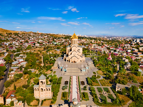 Holy Trinity Cathedral or Tsminda Sameba Church aerial panoramic view in Tbilisi old town. Tbilisi is the capital and the largest city of Georgia, lying on the banks of the Kura River.