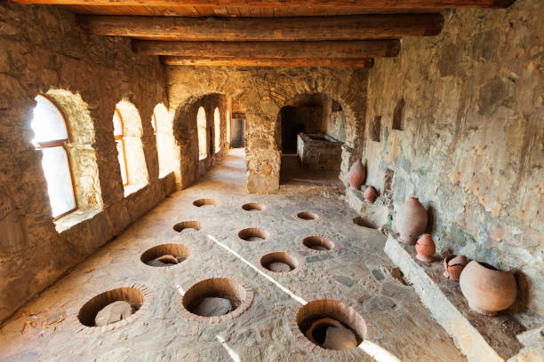Wine cellar with kvevri, Nekresi monastery Wine cellar with kvevri wine pots at ancient Nekresi monastery winery in Kakheti. Kakheti is a region in eastern Georgia with Telavi as its capital. kakheti georgia stock pictures, royalty-free photos & images