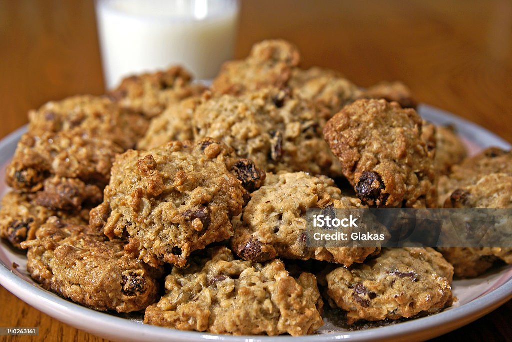 Homemade Cookies One glass of milk and a whole big plate of homemade cookies!                  Chocolate Chip Cookie Stock Photo