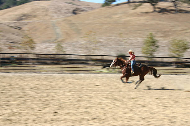 Girl riding horse going fast