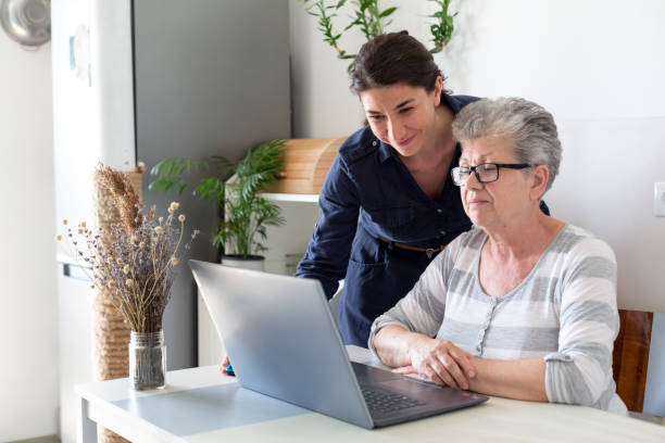 istock Young women helping senior women 1402632783