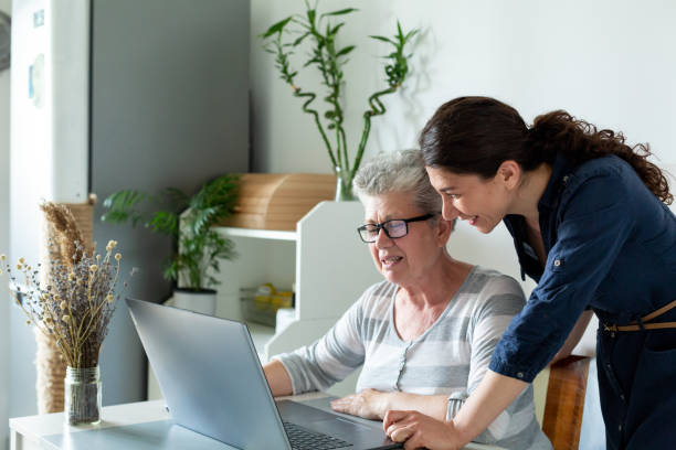istock Mother and daughter watching the computer 1402633002