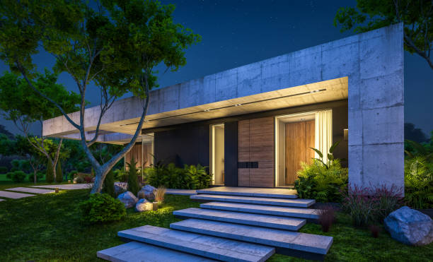 3d rendering of new concrete house in modern style in night stock photo
