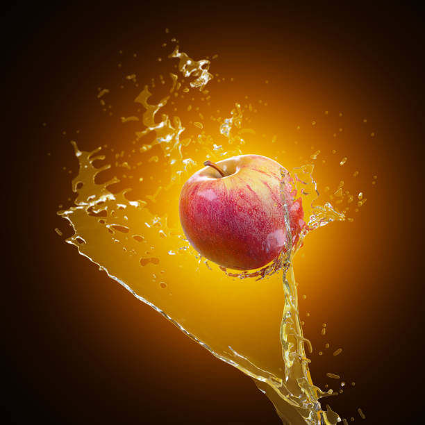 istock A flying red ripe apple in a splashing stream of water backlit. 3d rendering 1402634794