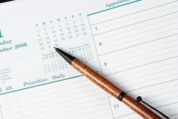 istock Day planner page and a wooden pen 140263510