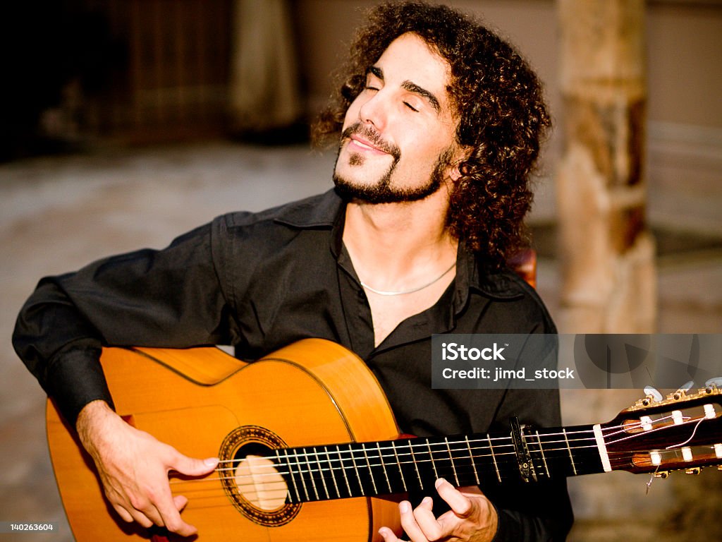 Flamenco Guitarist Flamenco guitar player strums in happy abandon. istockalypse, Barcelona Flamenco Dancing Stock Photo