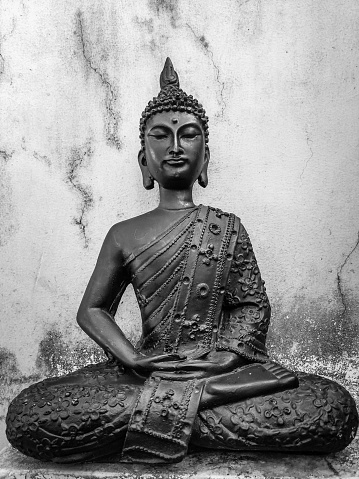 June 3rd 2021. dehradun Uttarakhand India. Buddha Purnima. An old Budha Statue sitting in lotus Pose with a vintage white background.