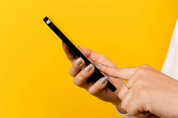 istock Hand and phone applications online and communicate with those around you. online communication concept 1402636121