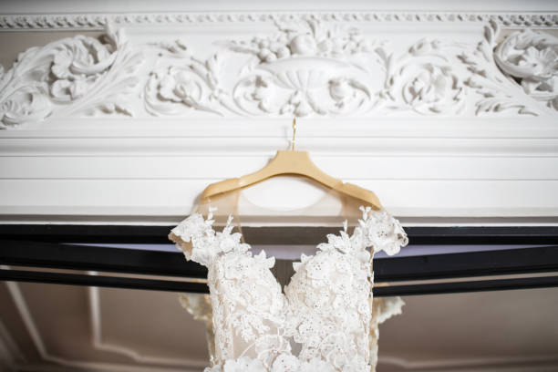 istock Wedding dress hanging on the door 1402637072