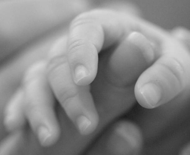 istock Baby holding mothers finger 140263818