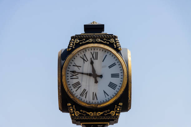 istock Old retro vintage street clock sky background 1402638887