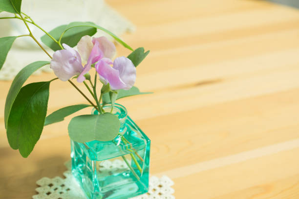 Cute little jug with eucalyptus leaves and sweet peas.