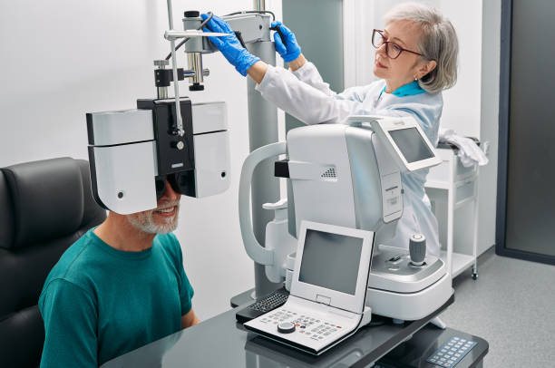 istock Optometrist doing eyesight test for senior patient using modern phoropter at ophthalmology clinic. Eye exam and vision diagnostic 1402639207
