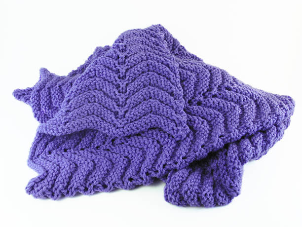 Purple Crochet Afghan A purple hand-crochet baby blanket on a white background. knitting photos stock pictures, royalty-free photos & images