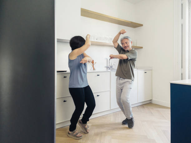 istock Couple dancing in the kitchen at home 1402640991