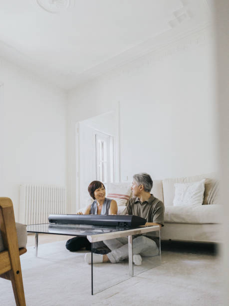 istock Couple playing piano at home 1402641079