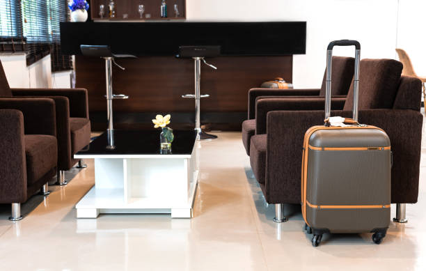 istock Passenger luggage putting on empty airline vip lounge floor 1402641216