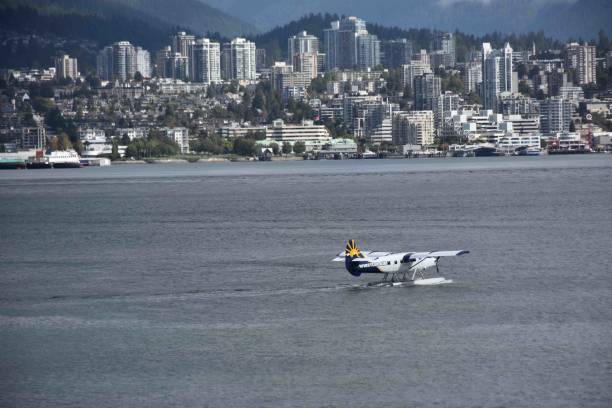 Vancouver City Harbour, Office, Residential Buildings, Docked Recreational Boat, Harbour Air Seaplanes View During Autumn Season In Canada
