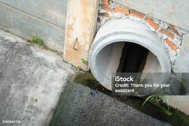 Industrial Sewage Water Draining Out From Cement Tube Stock Photo - Download Image Now