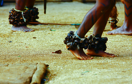 View of ceremonial rattles on the ankles of native dancers performing a ceremonial dance in a village on Vanuatu.