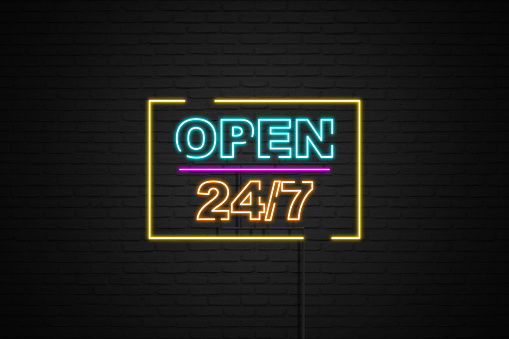 Open 24/7 hours neon light on black brick wall