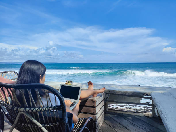istock Young Influencer Doing Live Streaming by The Beach 1402646440