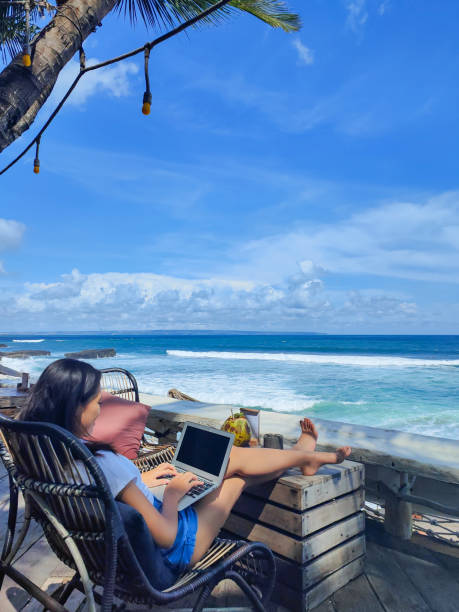 istock Young Asian Woman Working Remotely During Holiday 1402646564