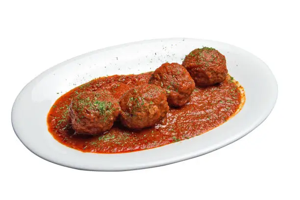White plate with Beef meats balls and tomato sausage.  Isolated with clipping path