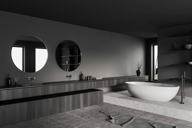istock Grey bathroom interior with sink and bathtub, towel and accessories 1402648116