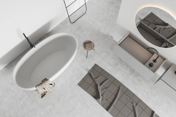 istock Top view of light bathroom interior with bathtub and sink, carpet 1402648464