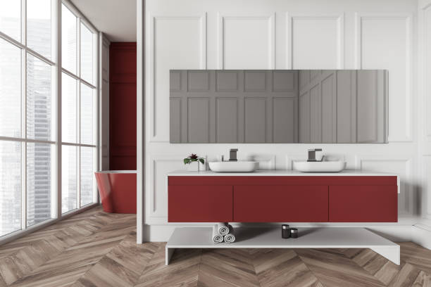 istock Light bathroom interior with sink and tub near panoramic window 1402648568