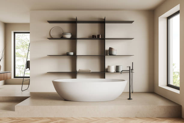 istock Light bathroom interior with tub, shelf with decoration and window 1402649005