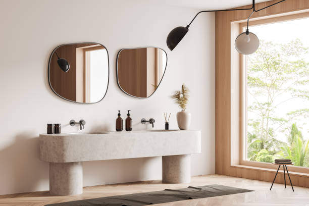 istock Modern bathroom interior with sink and mirror, accessories and window 1402649035