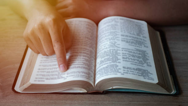 istock Close up of a man reading the Bible. 1402649828