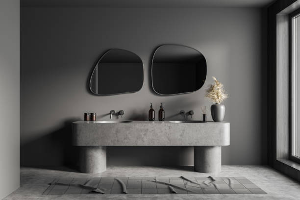 istock Grey bathroom interior with sink and mirror, accessories and window 1402649871