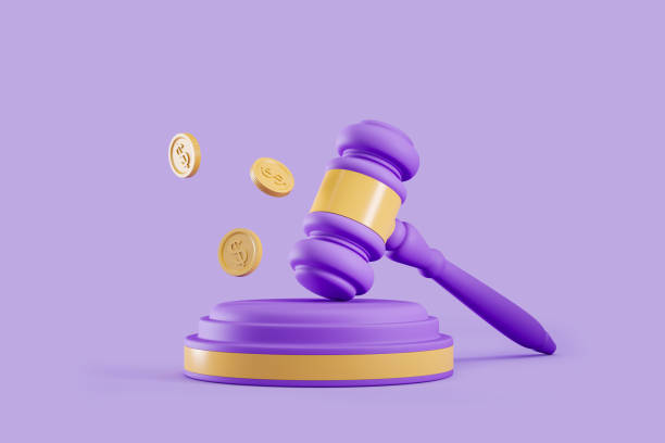 Auction gavel with coins on violet background, public sale stock photo