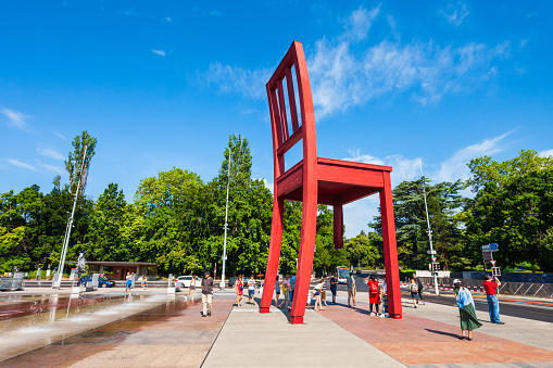 GENEVA, SWITZERLAND - JULY 20, 2019: Broken Chair or Chaise Cassee is a wooden sculpture by the Swiss artist Daniel Berset and Louis Geneve in Geneva city in Switzerland