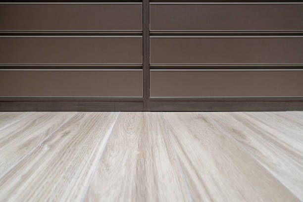 Dark cabinets and light wood flooring