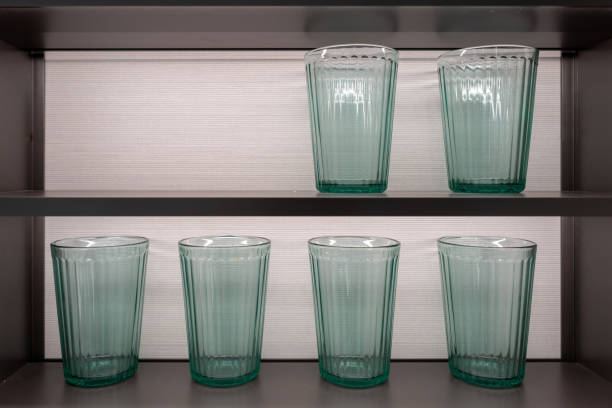 The green cup in the kitchen cabinet