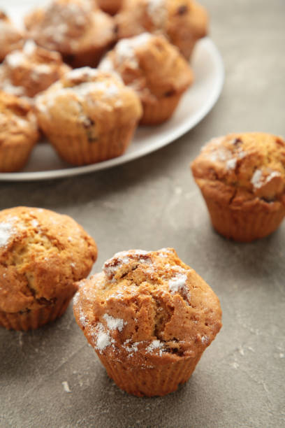istock Vanilla muffins. Sweet cupcakes on white plate. Top view. 1402652644
